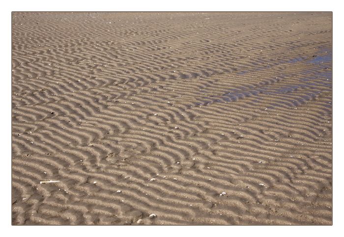 Sandmuster bei Ebbe am Strand von Merville-Franceville-Plage